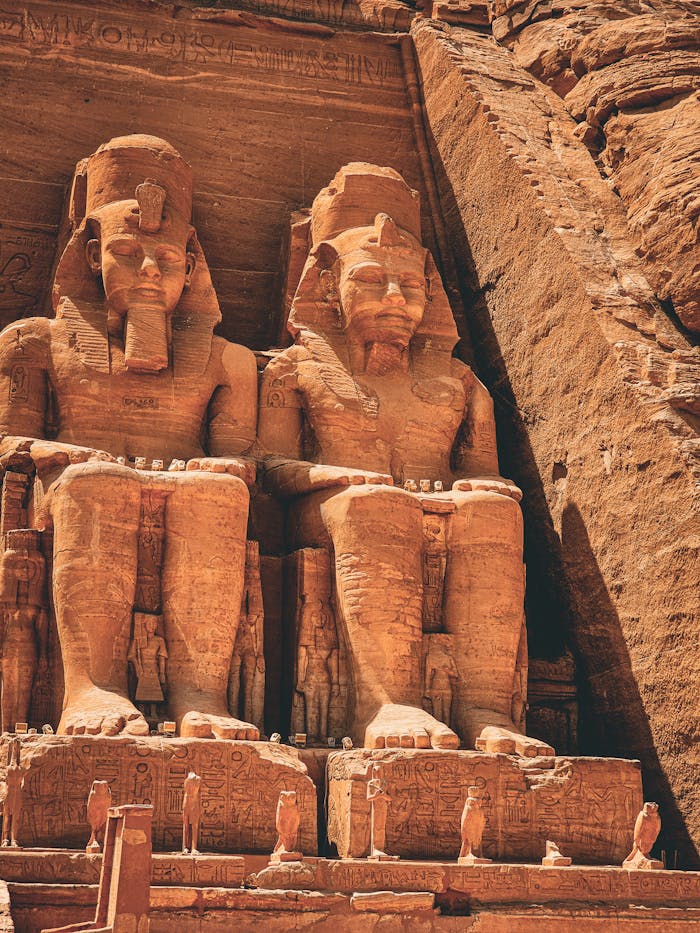 Services Ancient colossal statues at Abu Simbel, Aswan Governorate, Egypt, captured in warm daylight.